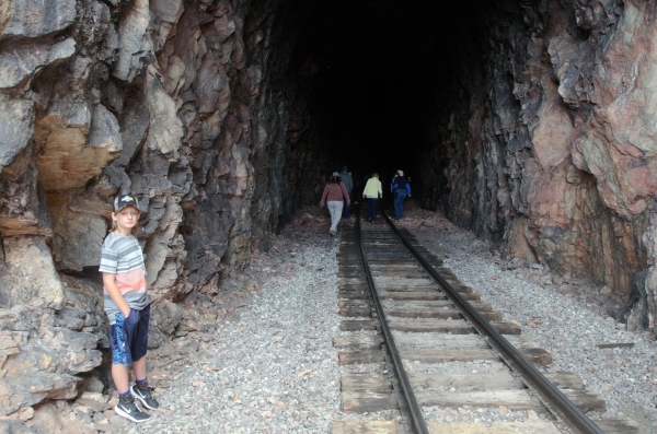 photo of visitors walking into Cumbres Toltec rail tunnel