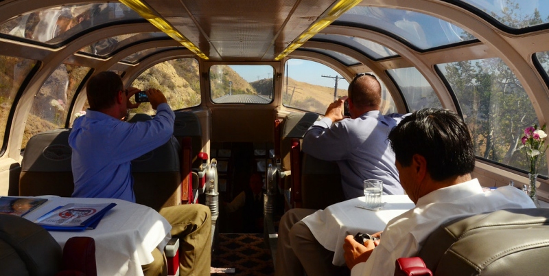 photo of riders in dome rail car