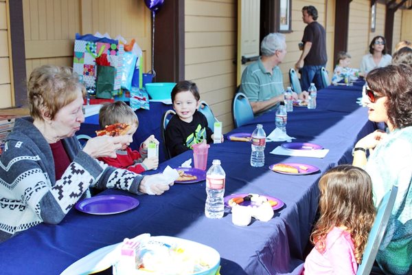 photo of birthday party on museum platform